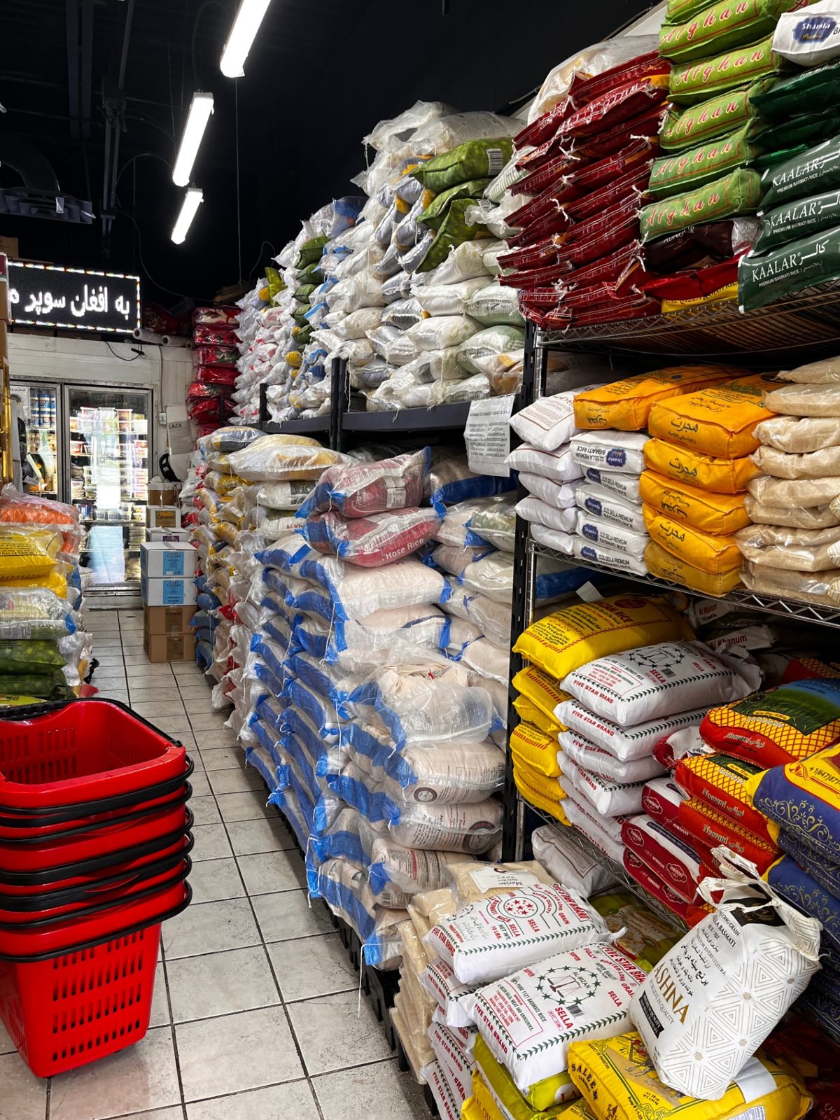 Bags of rice and grains stacked in the aisle