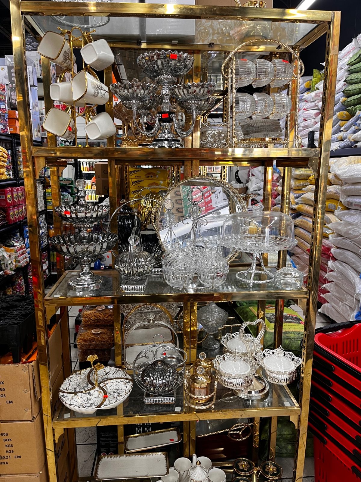 Ornate serving ware and glassware display case